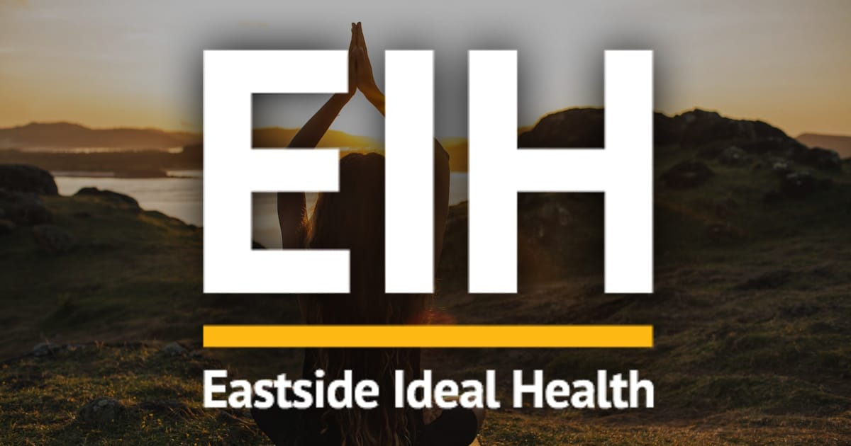eastside_ideal_health_social_media Patient receiving chiropractic consultation at Issaquah clinic